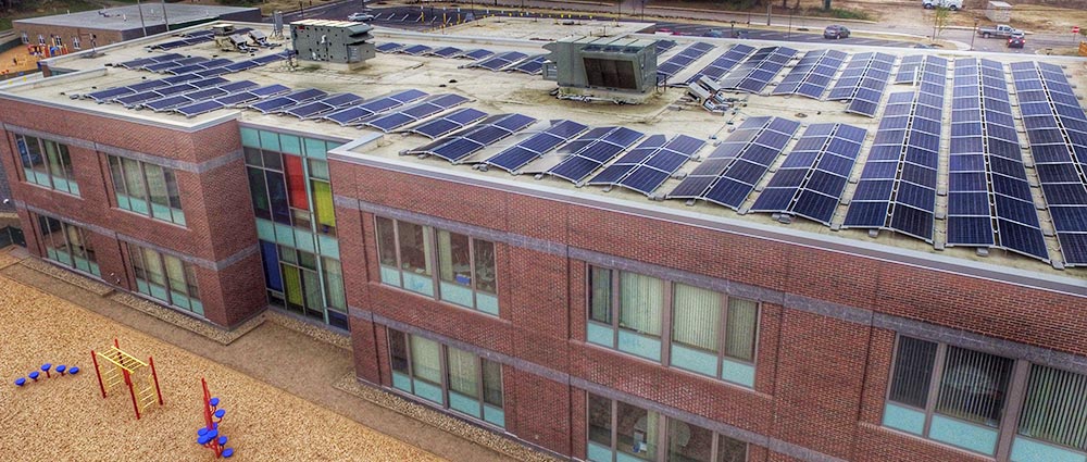 Elementary school with solar panels on the roof.